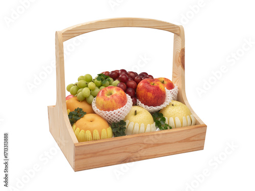 A variety of fruits are beautifully arranged in a pine wood basket isolated on white background
