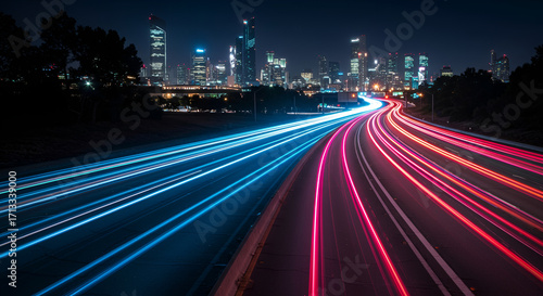 Long exposure shot of glowing neon cars crossing futuristic highway
