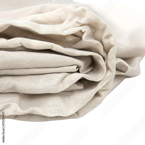 Close-up of neatly stacked and folded light beige natural fabric, showcasing a soft, organic texture with subtle creases and warm neutral tones, ideal for home textiles or design backgrounds