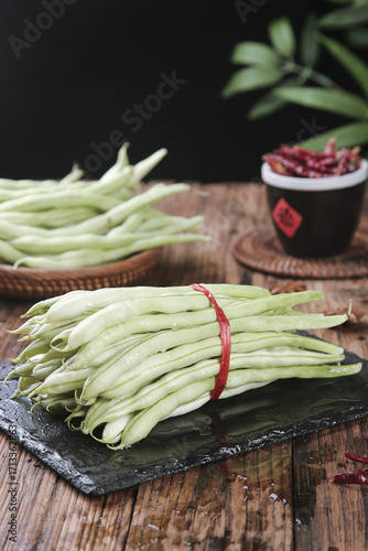 Photos Fresh White Bean Sprouts and Corn Husks on Rustic Wood Table with Kidney Beans