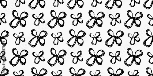 Seamless pattern of hand drawn black abstract flowers on a white background