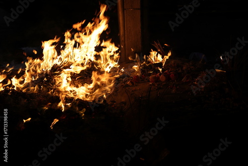 Chinese hungry ghost festival burning joss stick candle joss fake paper money flame fire smoke ash