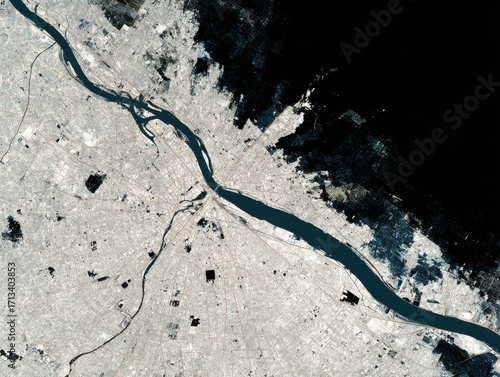 Urban planning analysis from space showing river, city layout, and building footprint with detailed urban infrastructure