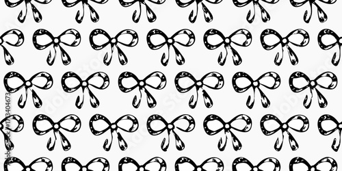 Seamless pattern of hand drawn black bow ties on a white background
