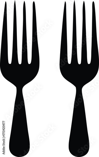 Two simple black forks standing upright a classic utensil pair for dining and food preparation