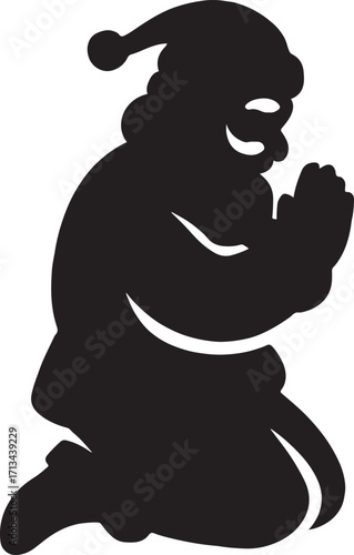 Silhouette of Santa Claus Praying on his Knees