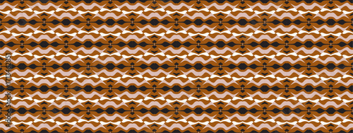 A close up of a repeating geometric pattern in shades of brown and white with a tribal feel.