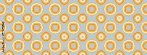 A seamless pattern of repeating circular floral motifs in warm golden hues on a calming sky blue background.