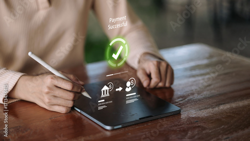 Mobile banking payment successful on tablet with stylus and secure money transfer