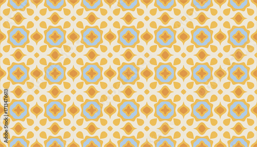 A seamless retro inspired pattern featuring a symmetrical arrangement of stylized floral motifs in a warm yellow and muted blue color palette perfect for vintage designs.