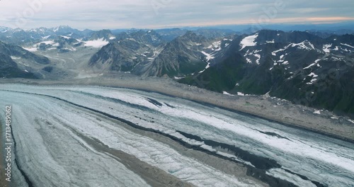 Flying above glacier formed by the melting waters in Denali National Park, Alaska.