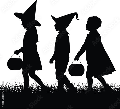 Children trick or treating in witch hats halloween