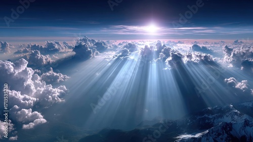 Bright Heavenly Light Breaking Through Cumulus Clouds Illuminating Distant Mountains Against Dawn Sky in Landscape Aerial View