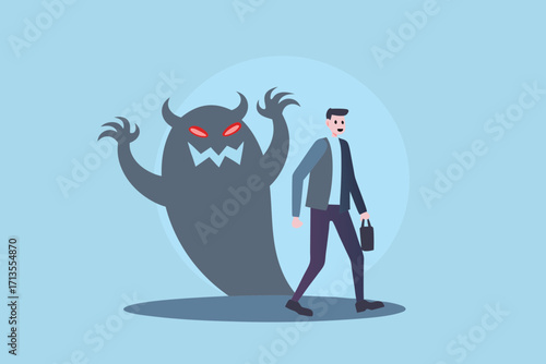 Businessman walking forward with a scary monster shadow looming behind him representing fear or challenges