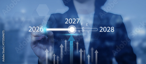 Wallpaper Mural A businesswoman touches a digital progress bar indicating the transition from 2026 to 2027 2028, symbolizing strategic planning, future readiness and challenge strategy for business startup Torontodigital.ca