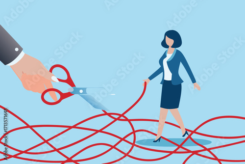 Businesswoman walks through tangled red thread as a hand with scissors prepares to cut it