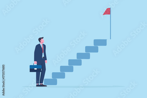 Businessman looking up at a staircase leading to a red flag representing success and goals