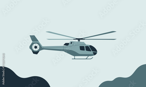 Sleek grey helicopter with rotating blades in flight.