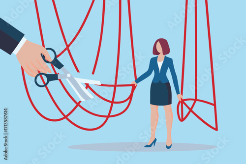 Businesswoman cutting puppet strings to gain independence and freedom from control