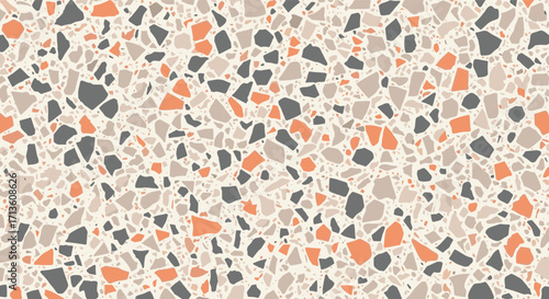 Abstract terrazzo pattern with beige grey and orange chips creating a textured surface.