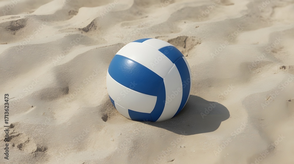 Obraz premium A blue and white volleyball rests on the sandy beach, ready for a game