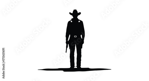 Silhouette of a cowboy standing with a rope in the desert