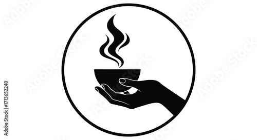 A hand gently holds a steaming cup within an oval frame