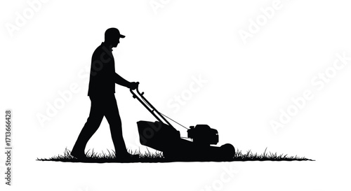 Silhouette of a man mowing the lawn on a grassy field