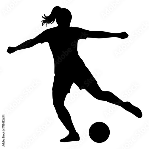 Silhouette of a female soccer player kicking a ball