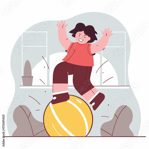 Kid balancing and enjoying playtime on an exercise ball indoors  