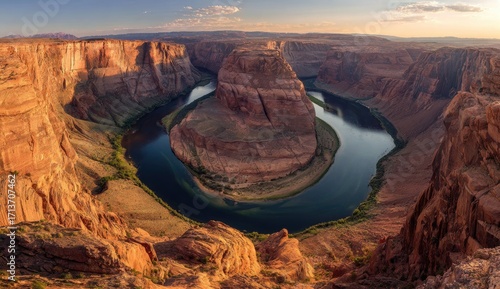 Grand Canyon's Horseshoe Bend, a sweeping vista of a river's loop, dramatic red rock formations, and a golden sunset