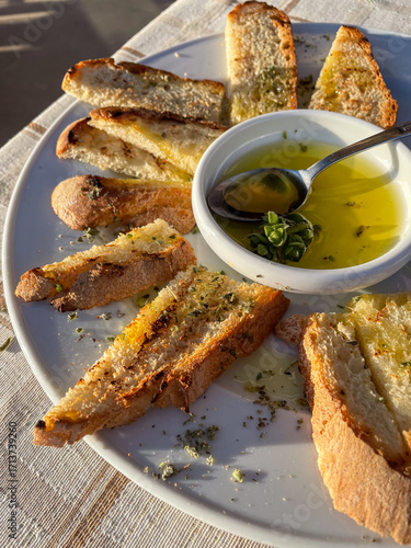 Bruschetta, toasted bread with olive oil, garlic and oregano. Italian simple cuisine