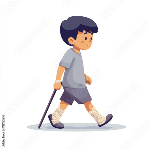 Boy with a cane walking carefully focused on his path.