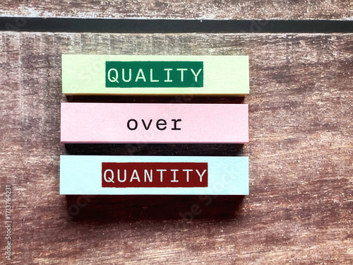 Quality over quantity concept background. Stock photo.