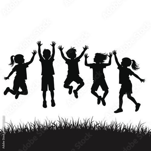 Five children silhouettes jumping in the air above grass