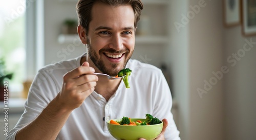 Man Eating Healthy Salad with Broccoli and Carrots