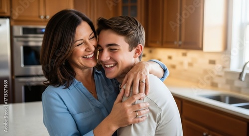 A loving mother embraces her smiling teenage son in a warm, sunlit kitchen, sharing a moment of joy and connection.
