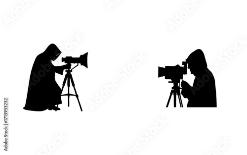 Two silhouettes of hooded figures operating cameras on tripods against a white background in a studio