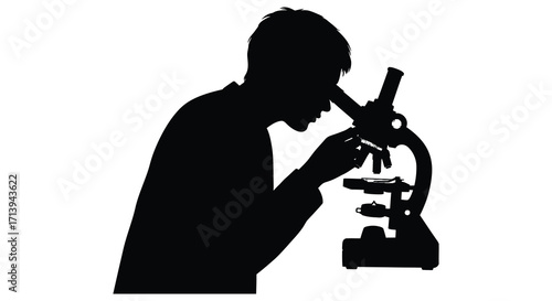 Silhouette of a scientist intently observing through a laboratory microscope