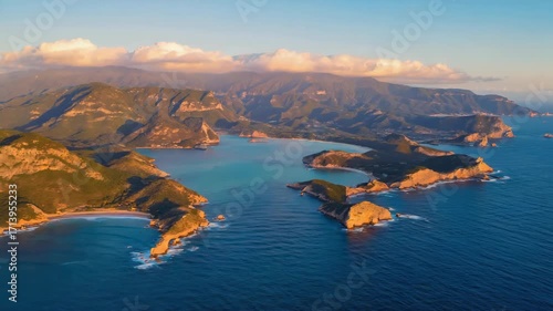 Majestic Coastal Landscape at Sunset Featuring Rugged Mountains and Serene Ocean Views