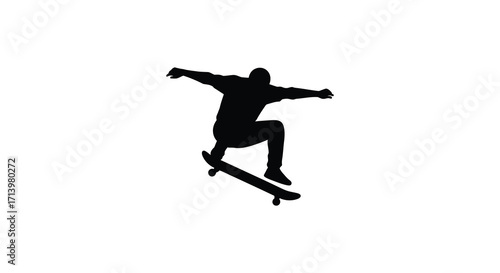 Silhouette of a skateboarder mid jump against a plain white background