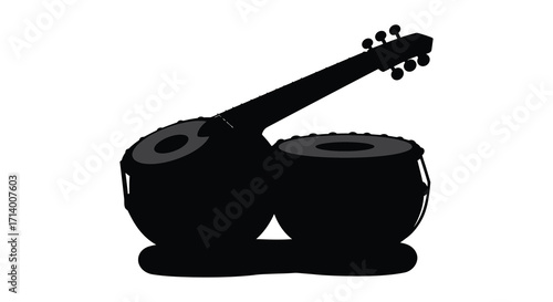 Silhouette of a sitar and two traditional indian drums isolated on white