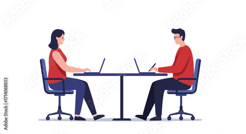 Collaborative office workspace with two professionals working on laptops