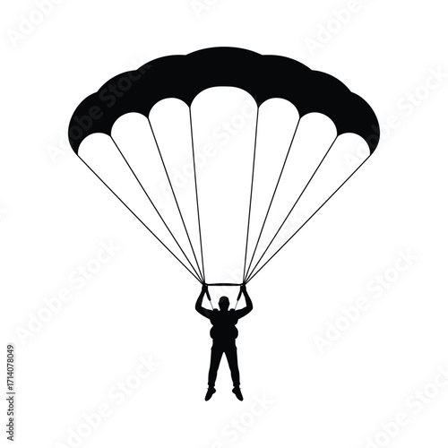 Silhouette of a skydiver descending under a parachute