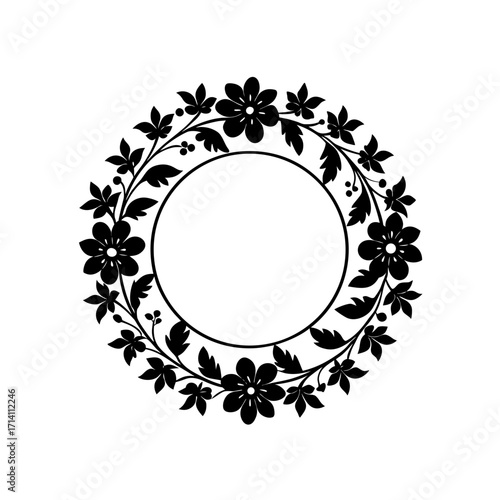 Floral wreath with flowers leaves and berries arranged in a circular pattern around a blank circle space