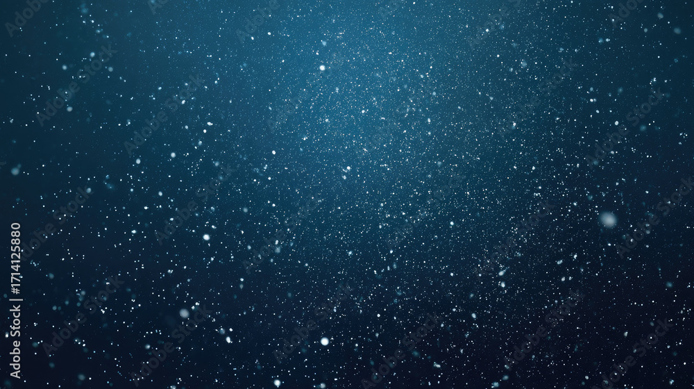 Fototapeta premium Abstract particles shimmering against a gradient dark blue background.