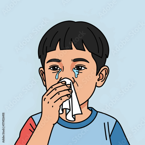A young boy with dark hair is wiping his nose with a white tissue, showing tears streaming down his face.