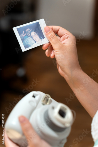 Holding instant print from a retro camera