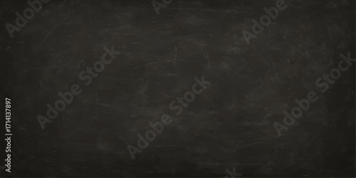 Grunge textured black chalkboard with a blank, rough surface and aged, vintage design for a dark wallpaper backdrop