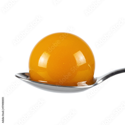 Translucent Molecular Gastronomy Sphere on a Silver Spoon